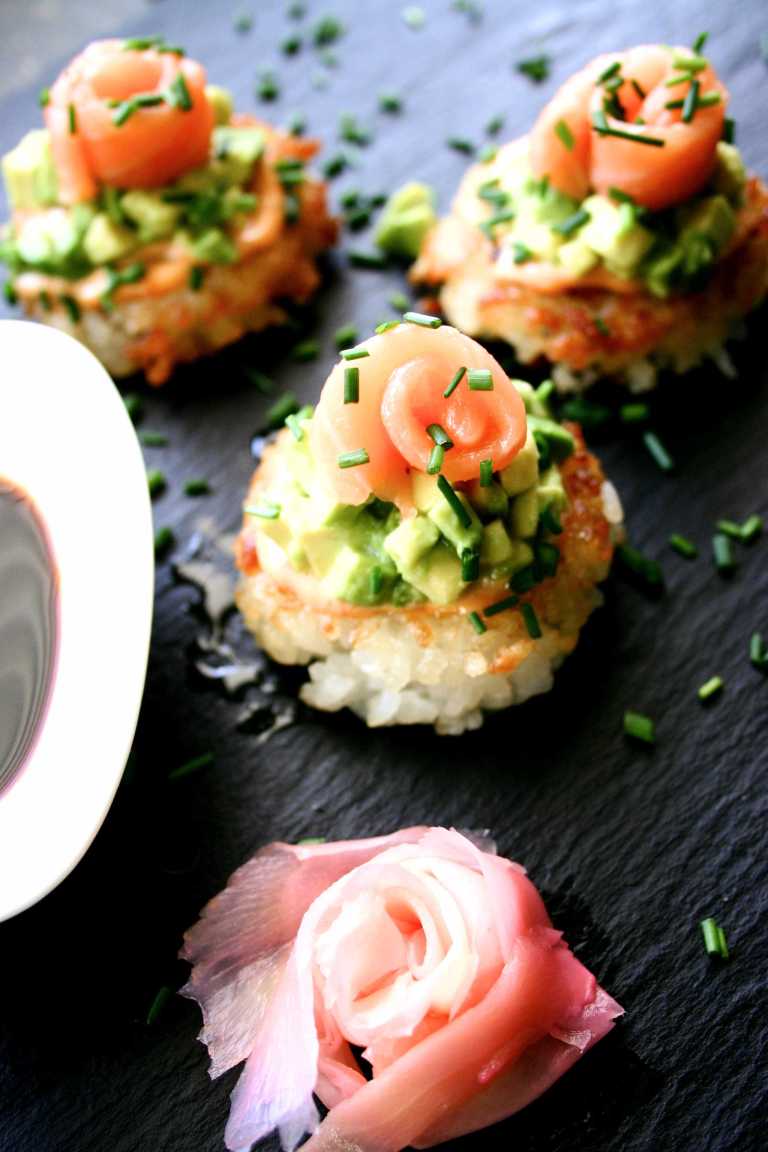 Sushi pizza -sirracha-mayo, avocado and salmon with pickled ginger and sweet Indonesian soy